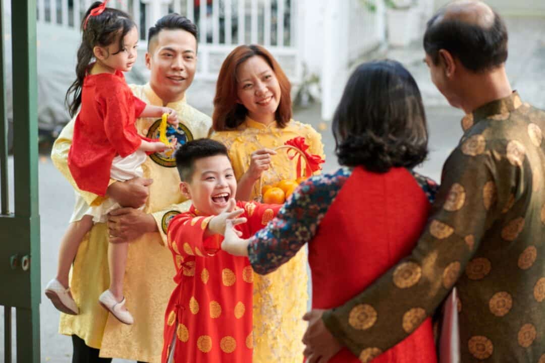 a family wearing different chinese new year clothings