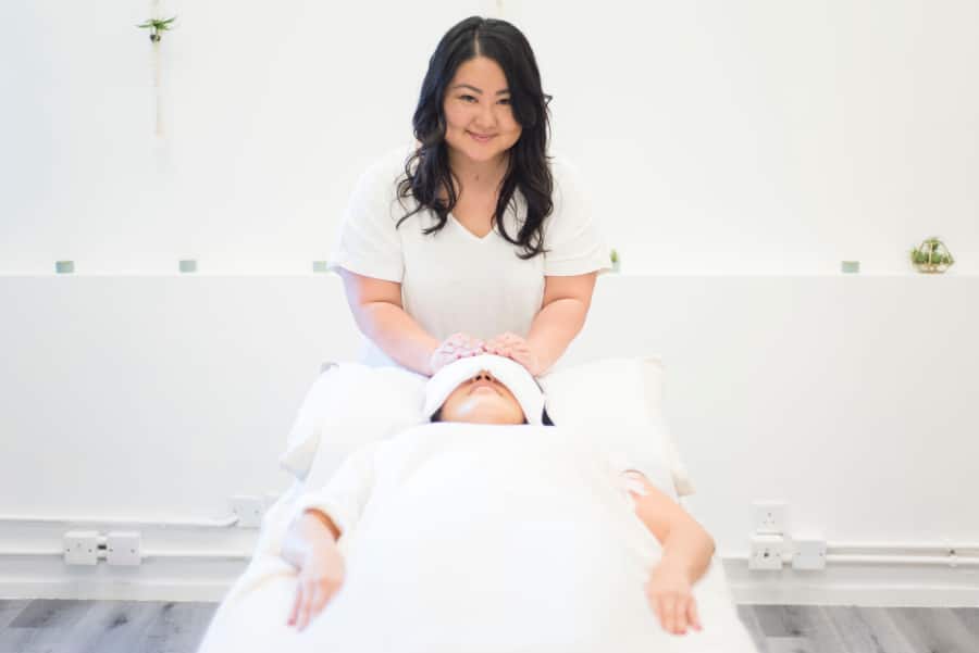 corie chu doing a spiritual healing session