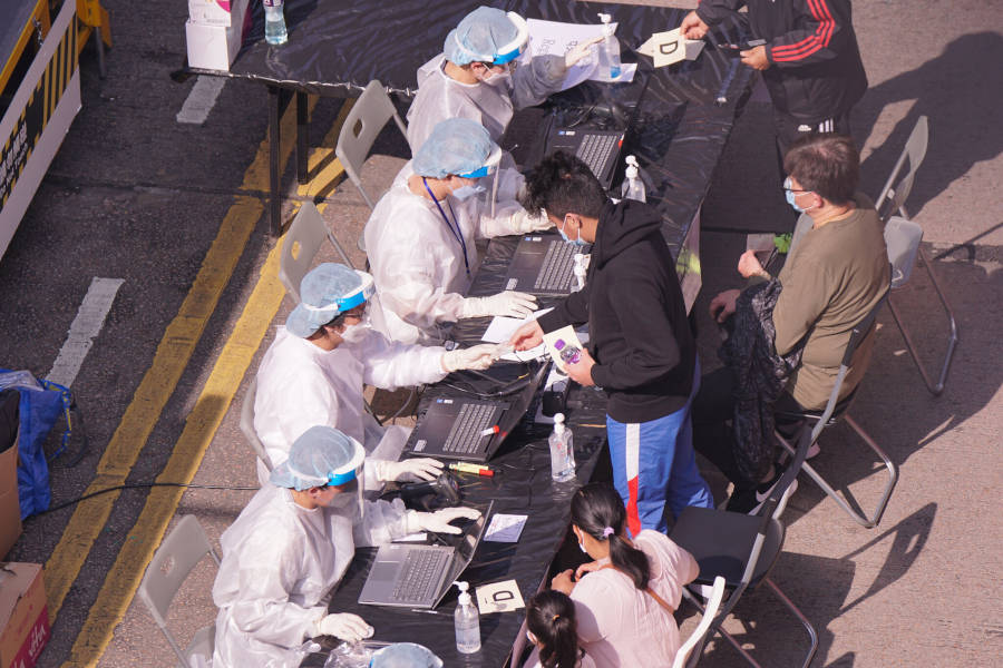 staff at temporary covid-19 testing station