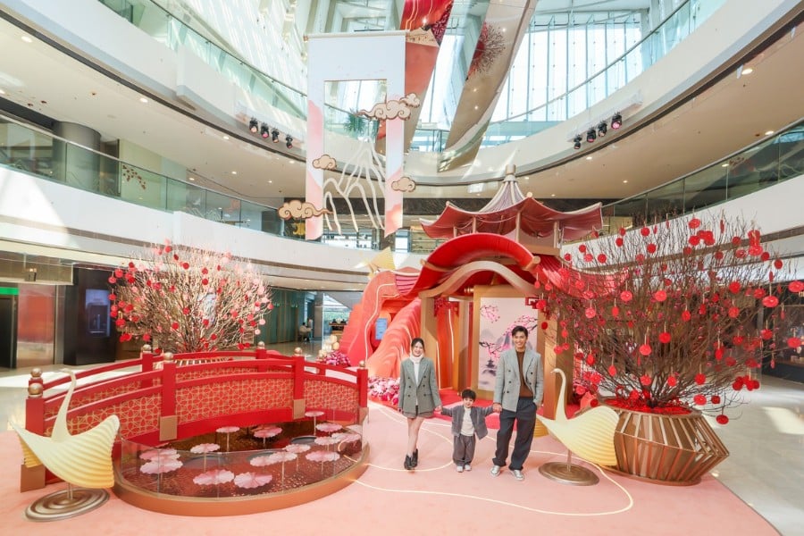 families take photo at ifc's chinese new year installation in central