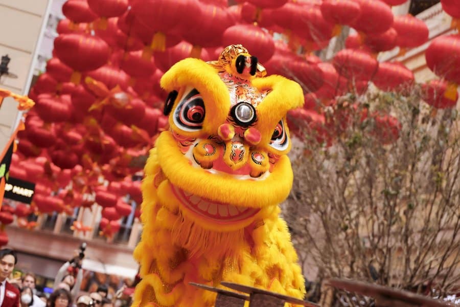 a golden lion during lion dance at lee tung avenue