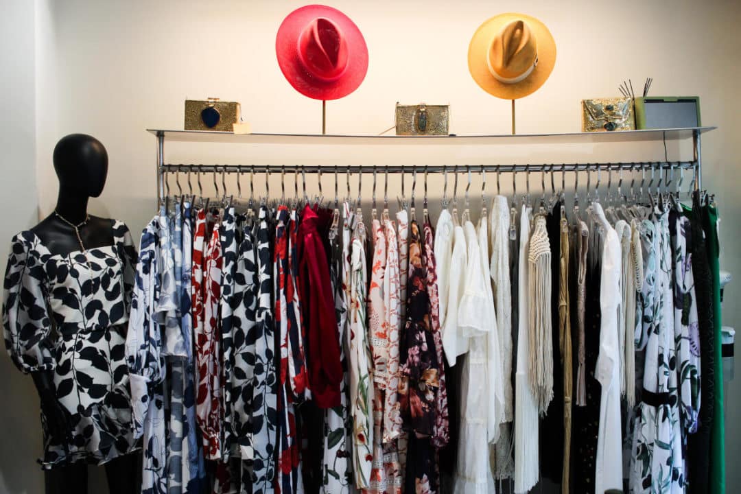 resortwear hanging on racks at vipop boutique in hong kong's soho area