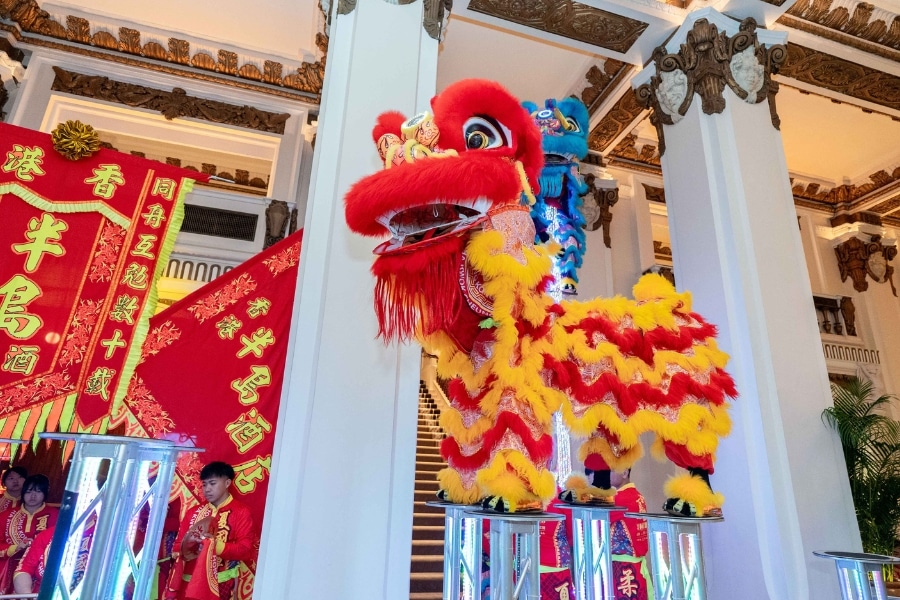 lion dance performance in the lobby of the peninsula tsim sha tsui